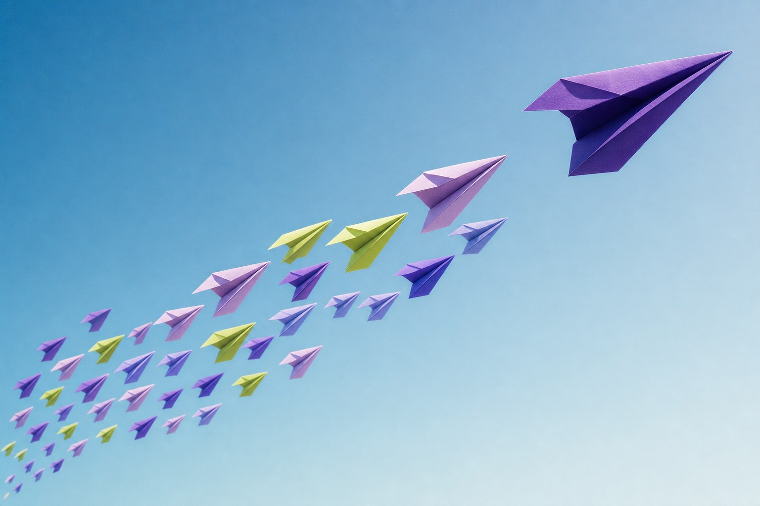 Flock of violet and lime paper planes across a blue sky